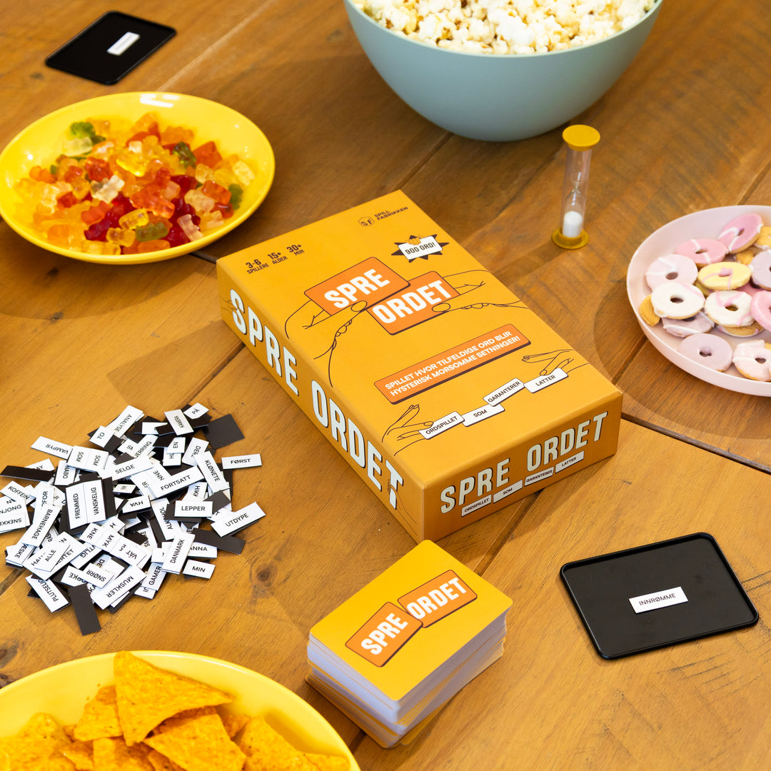 Spre Ordet - eske og ordmagneter med snacks på bordet